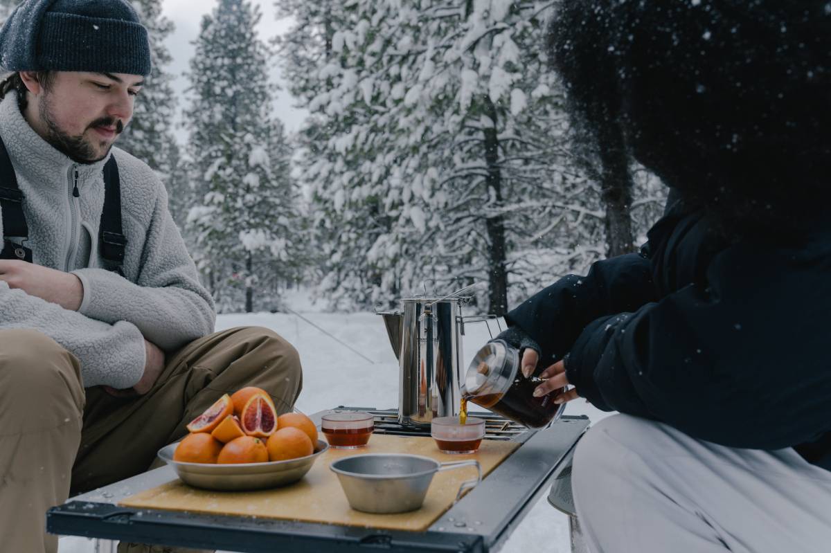 couple enjoying meal time outdoor cooking